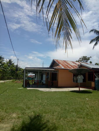 house in the village against a clear sky backgroundの写真素材