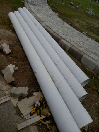 four big pipes on the groundの写真素材