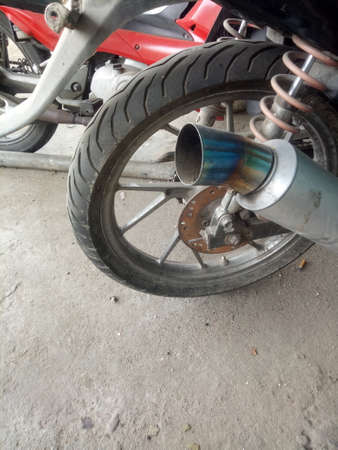 the exhaust pipe, motorcycle shock breaker and motorcycle wheel in Indonesiaの写真素材