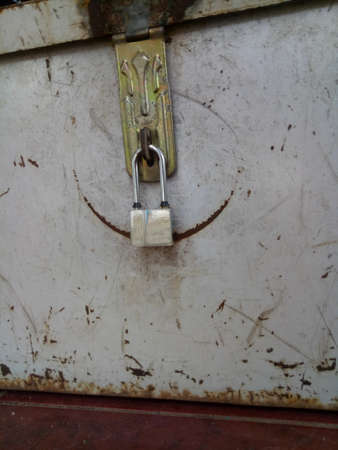 Small padlock in metal safeの写真素材