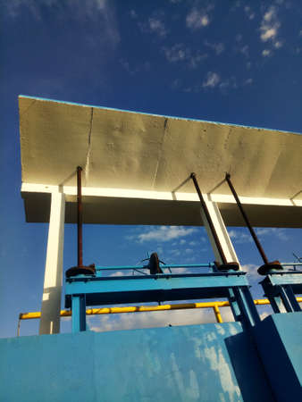 blue mini sluice building on the lake