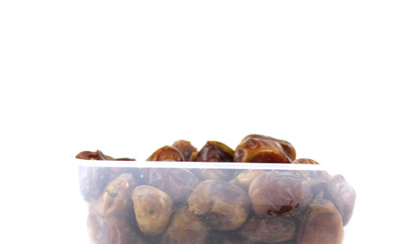 fruit dates isolated on white backgroundの写真素材