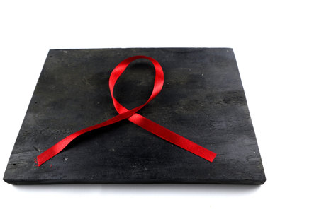 red aids ribbon on old wood backgroundの写真素材