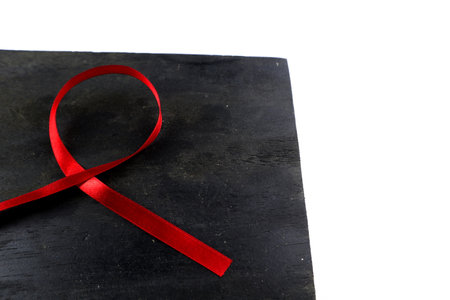 red aids ribbon on old wood backgroundの写真素材