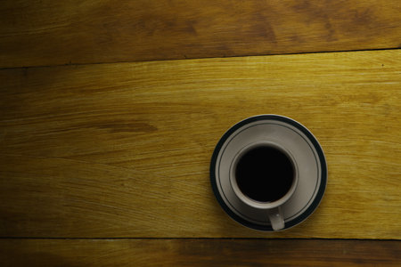 cup of black coffee on a wooden background. copyspace areaの写真素材