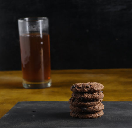 cookies and tea on black backgroundの写真素材