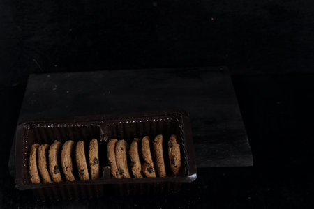 Chocolate chip cookies on black backgroundの写真素材