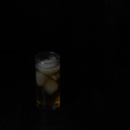 Ice tea isolated on black backgroundの写真素材