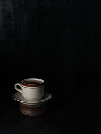 Cup tea isolated on a black backgroundの写真素材