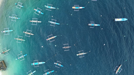 Aerial view of rows of fishing boats in the seaの写真素材