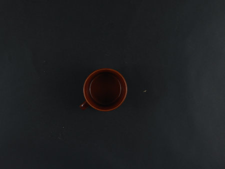 ceramic mug isolated on black backgroundの写真素材