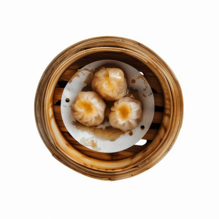steamed dumpling dim sum in bamboo steamer isolated on white backgroundの素材