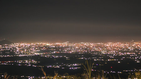 Night view of the city from the top of the mountain in the eveningの写真素材