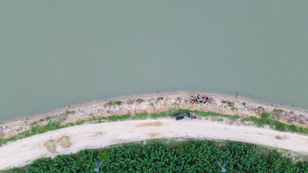 Aerial view of a lake bank in the countryside.