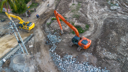 Aerial view of excavator working at construction site, top view