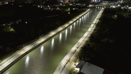 Aerial view of river and bridge at night in Bangkok, Thailand