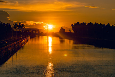 Golden Sunset Reflection over Canalの写真素材