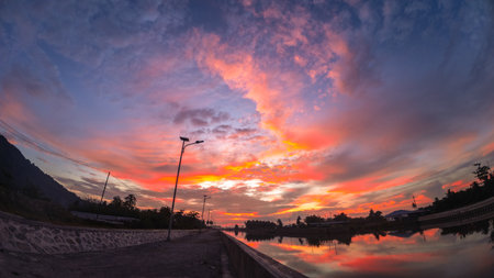 Colorful Sunset Sky Reflected in Waterの写真素材