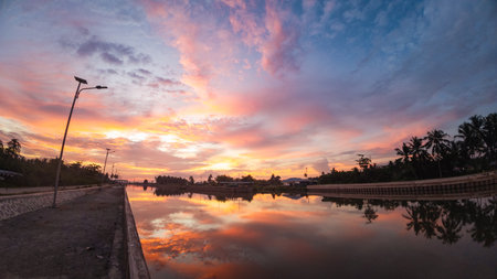 Scenic Sunset Reflection on the Waterの写真素材