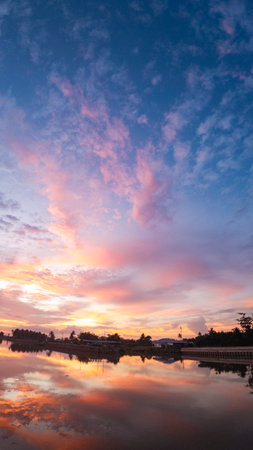 Colorful Sky Reflected in Water at Sunsetの写真素材