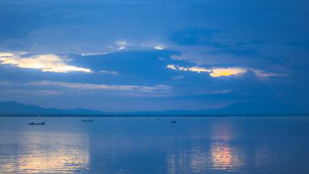 Tranquil Seascape with Boats at Twilightの写真素材