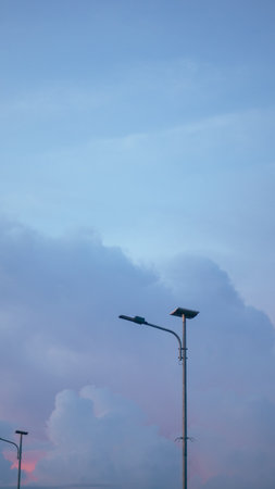 Street Light Against Cloudy Sky at Dusk