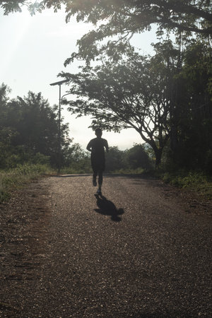 Silhouette of Man Running Outdoorsの写真素材