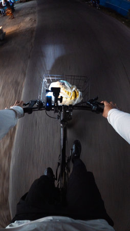Bike with a basket in the hands of a cyclist