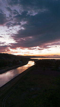 River Leading to Lake at Sunset