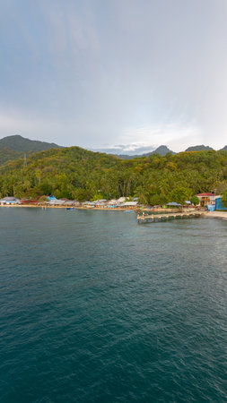 Coastal Village by Lush Green Hillsの写真素材
