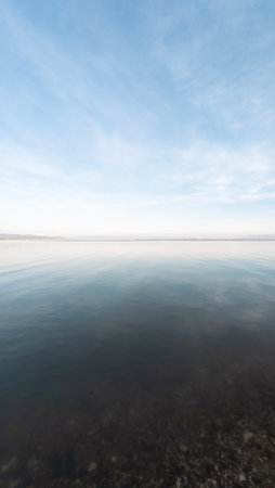 Calm Ocean Water and Cloudy Skyの写真素材