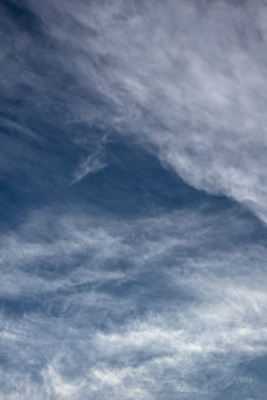 Wispy Cirrus Clouds Against Blue Sky