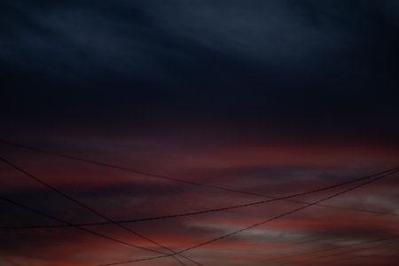 Dramatic Sunset Sky with Power Linesの写真素材