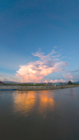 Scenic Sunset Reflection Over Waterの写真素材