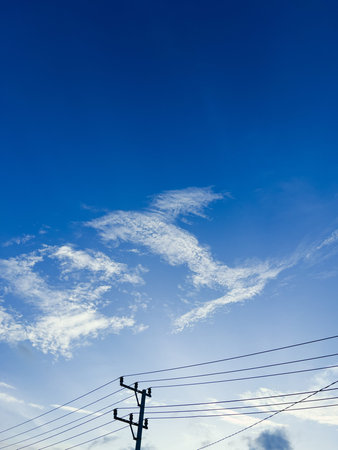 Telephone Pole Against Blue Sky