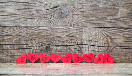 emotional red hearts on wooden background