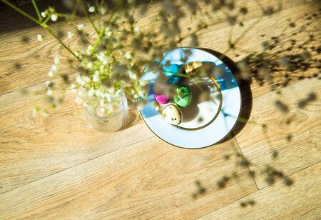 natural quail eggs on a saucer with a blue border, easterの写真素材