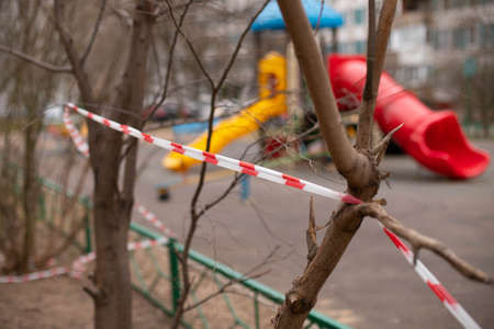 a playground fenced with warning tape. Virus. stay homeのeditorial素材