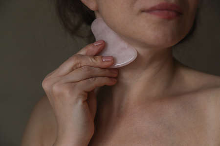 Modern accessories for self-facial massage. Self facial massage for woman
