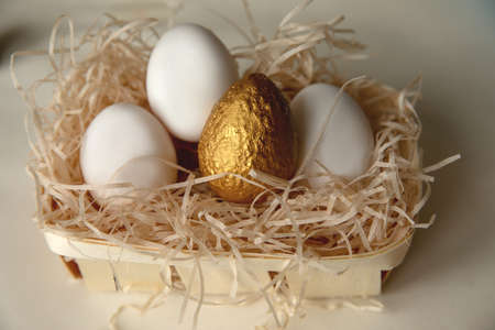 Preparing for Easter. Decorating - painting eggs. Easter eggs in a basket. Preparing for Easter. Coloring. Decoratingの写真素材