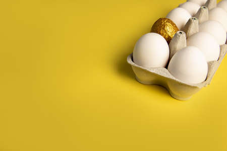 Preparing for Easter. Decorating - painting eggs. net for eggs on a yellow background.の写真素材