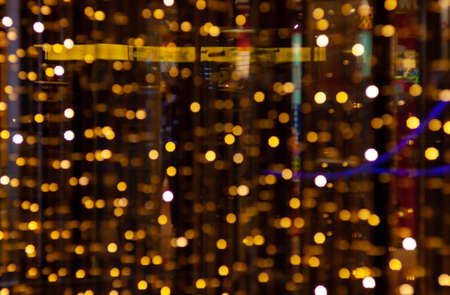 Rose gold sparkles on a black background. Abstract image. Background for design and your projects.の写真素材