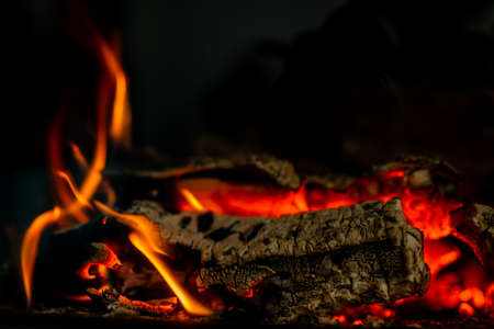 Firewood is burning in the fireplaceの写真素材