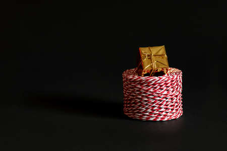 Materials for packing gifts on a black background.