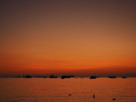 sunset sea boatの写真素材