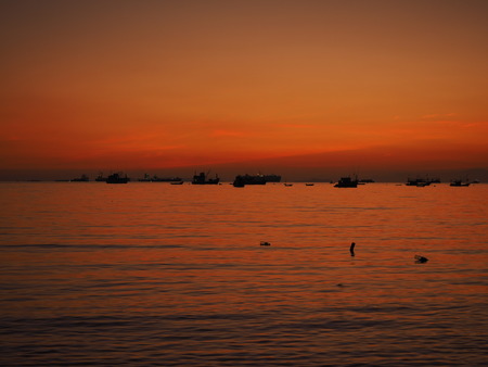 sunset sea boatの写真素材