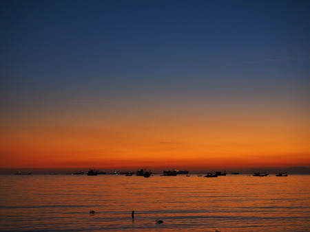 sunset sea boatの写真素材