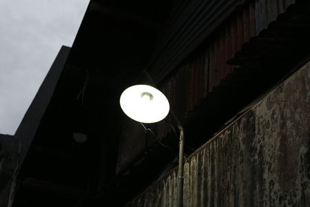 street lamp in front of old buildingの写真素材