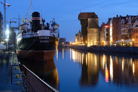 Gdansk, Poland - April 14, 2018: Old town of Gdansk with ancient crane at duskのeditorial素材