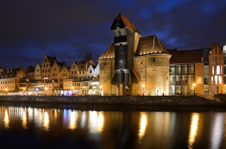 Gdansk, Poland - April 15, 2018: Old town of Gdansk with ancient crane at duskのeditorial素材